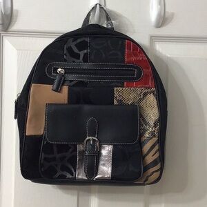 Dressy patchwork design midsized CM trademarked backpack. Beautiful!